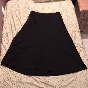 Long solid black skirt.